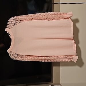 Light pink long sleeve shirt lace detail on sleeves. Never worn.  Zipper in back